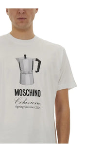 Moschino men’s white t-shirt featuring a black and silver moka pot graphic with spring summer 2025 text