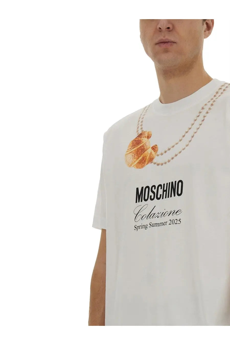 Moschino men’s white t-shirt with golden croissant graphic and pearl chain with black moschino colazione text summer 2025