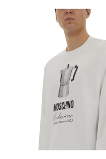 Moschino men’s white long-sleeve sweatshirt with black and silver moka pot graphic and moschino colazione spring summer 2025 print