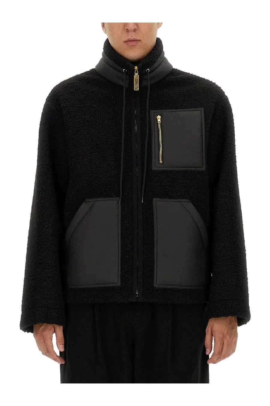Moschino men’s black shearling jacket with matte black panel accents and gold tone zippers