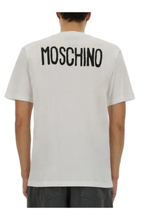 Back view of white moschino men’s cotton t-shirt with bold black moschino lettering across the back