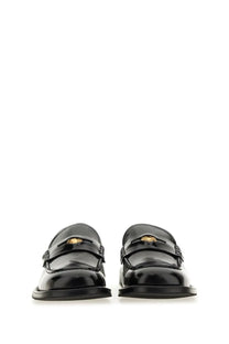 Moschino men’s moccasin Berlin black patent leather loafers with gold-tone Medusa head logo on the front