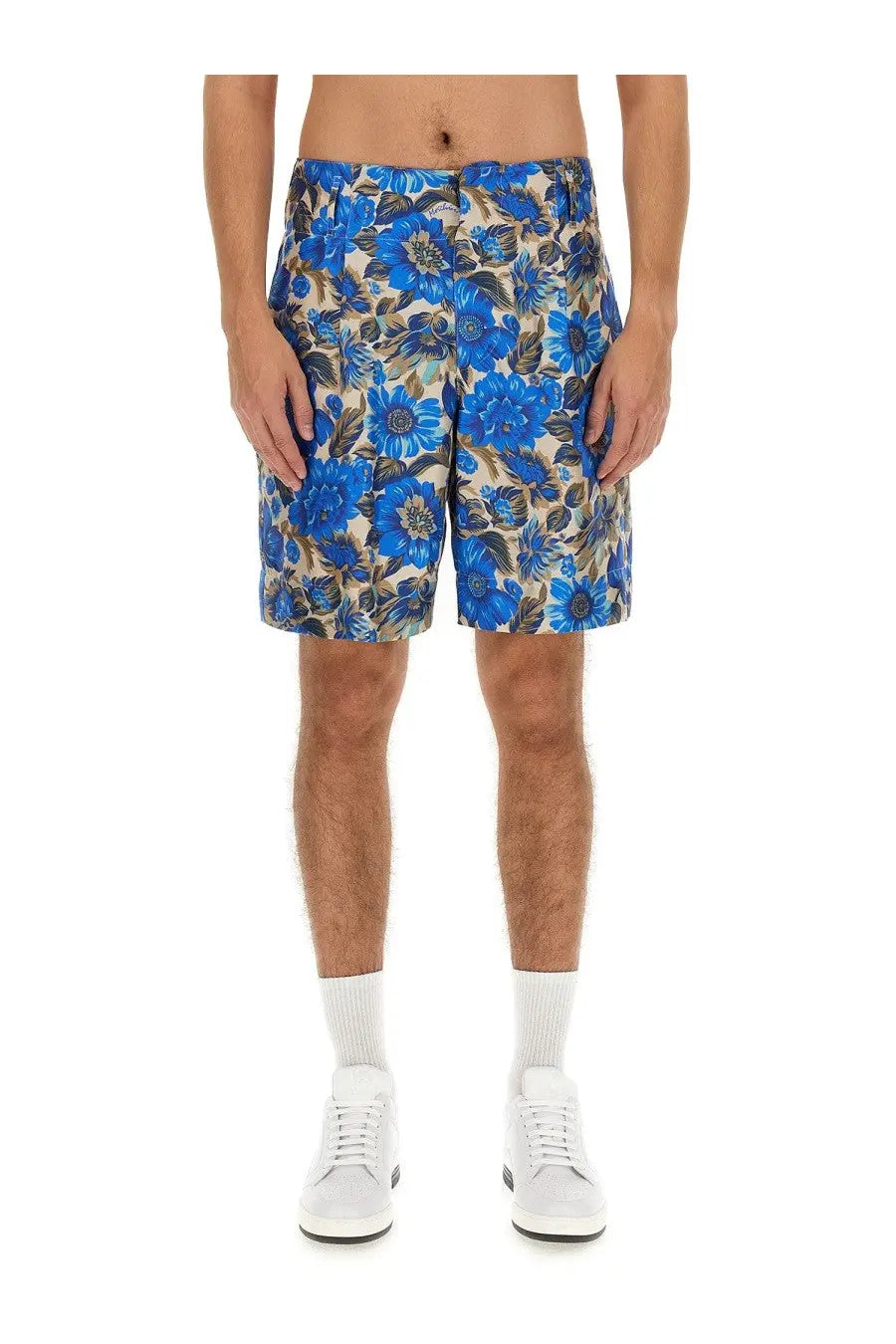 Moschino men’s shorts with blue floral pattern and beige and brown accents perfect for casual summer wear