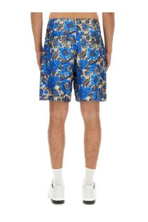 Moschino men’s blue floral patterned shorts with beige and dark green accents and pleated design