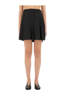 Moschino women’s black wool asymmetrical shorts with a structured waistband and tailored pleated mini skirt design