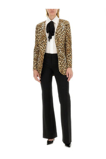 A leopard-print blazer with a bold glossy finish and classic tailored fit paired with moschino women’s black crepe pants