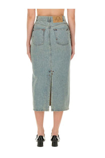 Moschino women’s light-wash denim midi skirt with front zipper and brown leather patch on waistband
