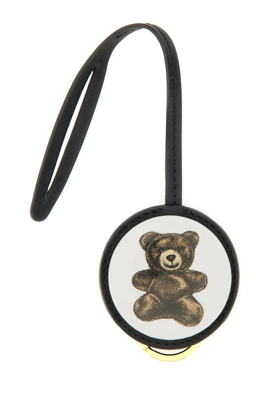 Moschino women’s leather keychain with black strap, white badge featuring brown teddy bear, and gold-tone clasp