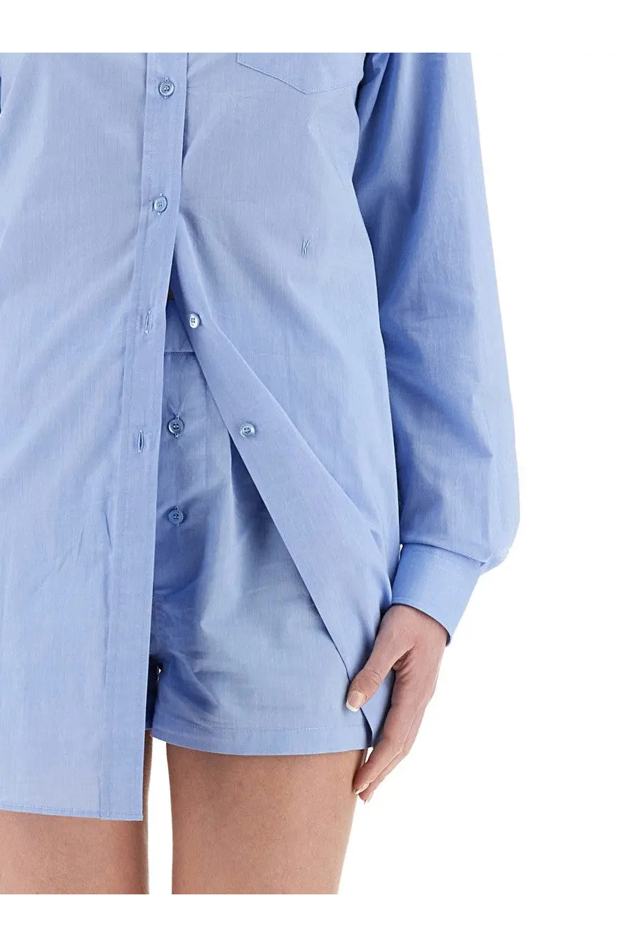 Moschino women’s light blue poplin shirt dress with long sleeves and a front pocket in a chemise jumpsuit style