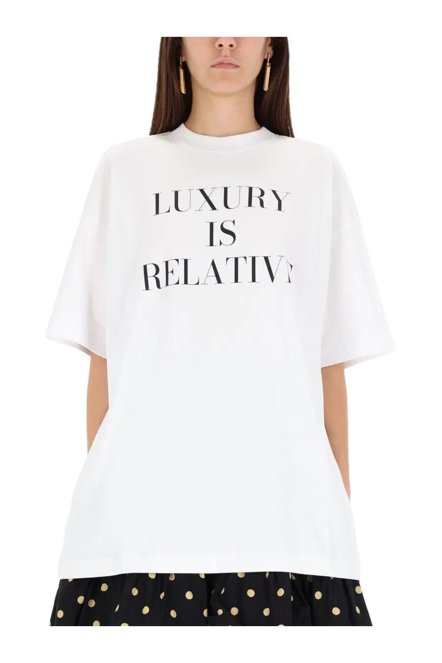 Moschino women’s white oversized cotton t-shirt with bold black luxury is relative text across the chest