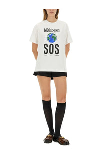 Moschino women’s white cotton t shirt with bold black sos graphic and blue green globe print on front center