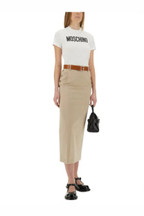 Black leather mini handbag with structured shape and top handle paired with moschino tailored twist beige skirt