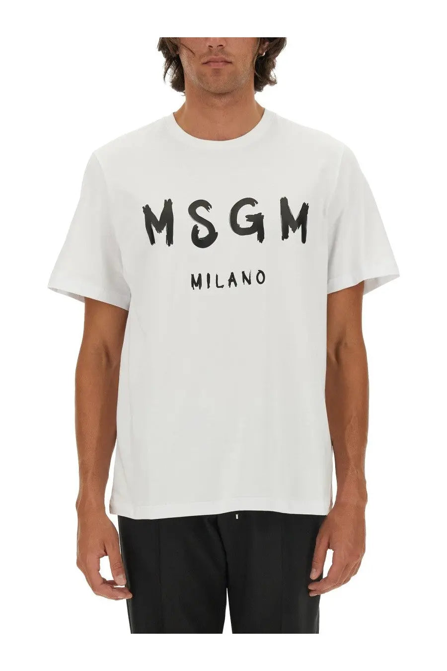 White MSGM Milano cotton t-shirt featuring bold black brushstroke lettering on the front
