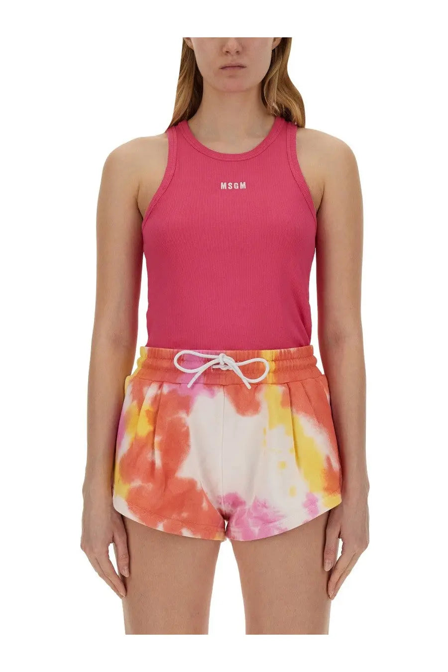 A vibrant pink ribbed tank top with a white msgm logo on the chest for women