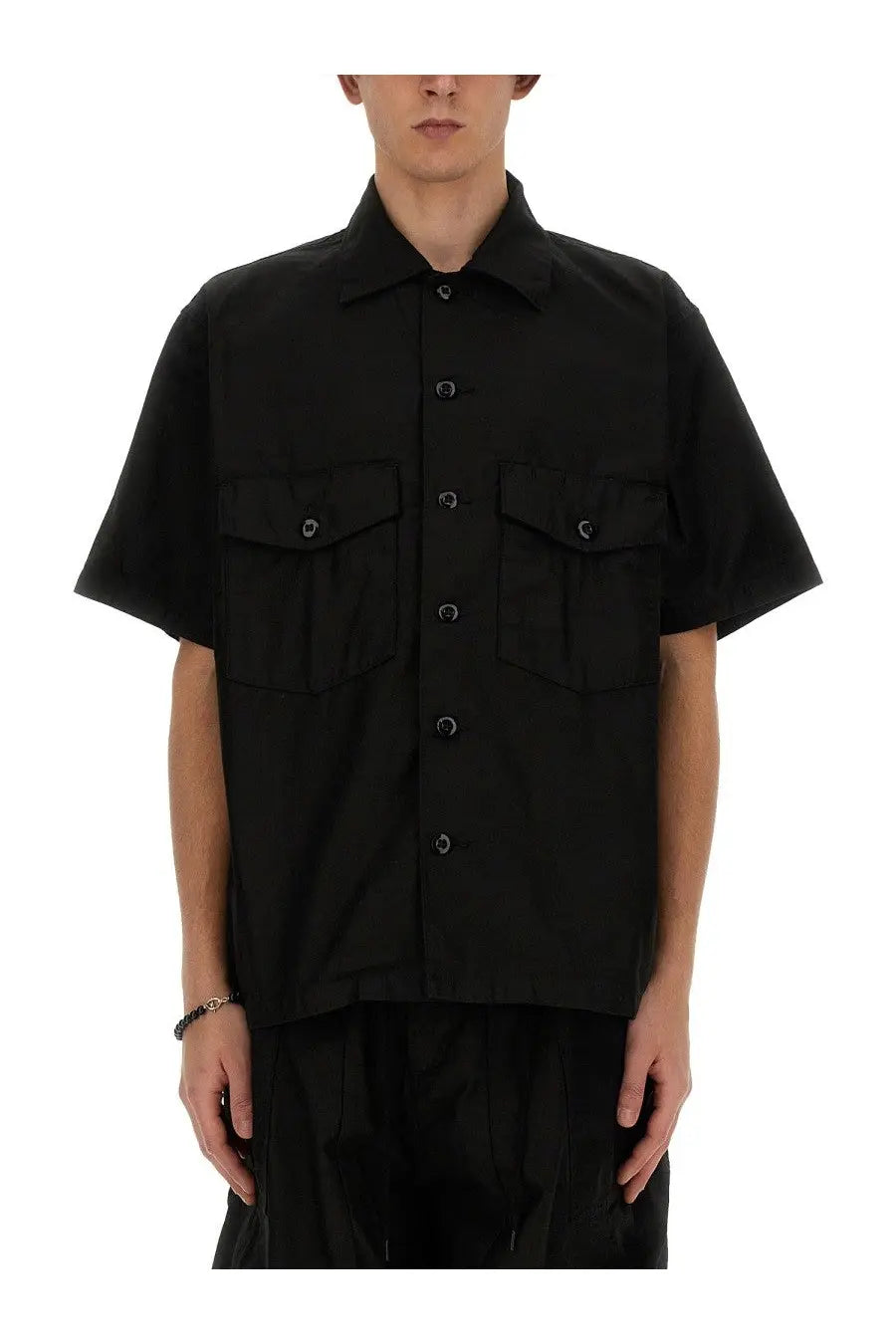 Needles men’s black cotton short-sleeved button-up shirt with two chest pockets and dark buttons