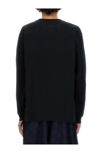 Needles men’s black long-sleeved crewneck shirt with a simple minimalist design perfect for casual wear