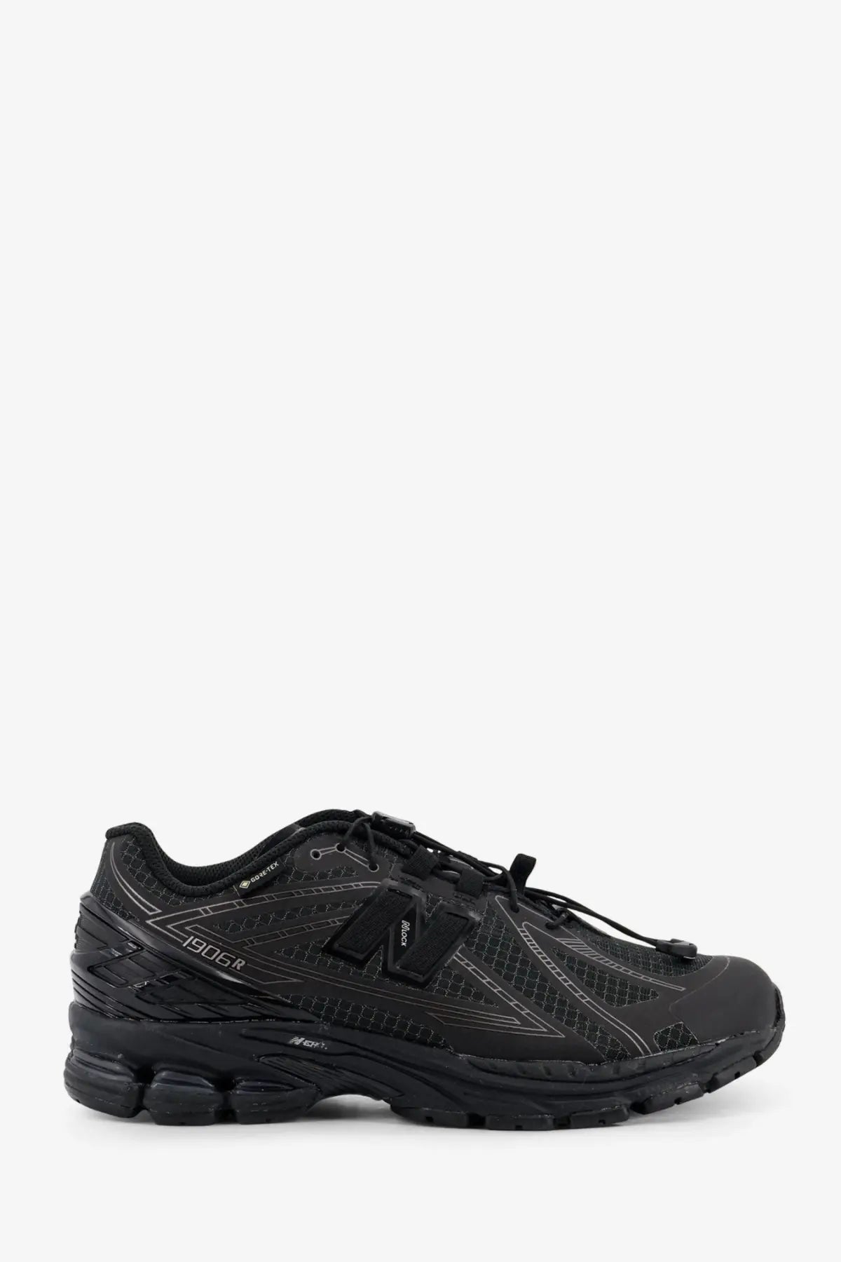 New Balance men’s Gore Tex black 1906r running shoe with mesh and synthetic overlays and gray stitching details