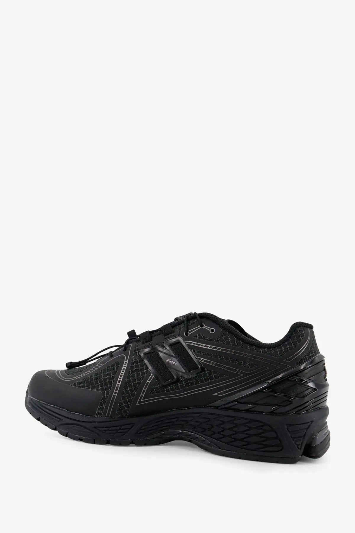 New Balance men’s Gore Tex black running shoe with mesh and synthetic overlays and subtle reflective accents