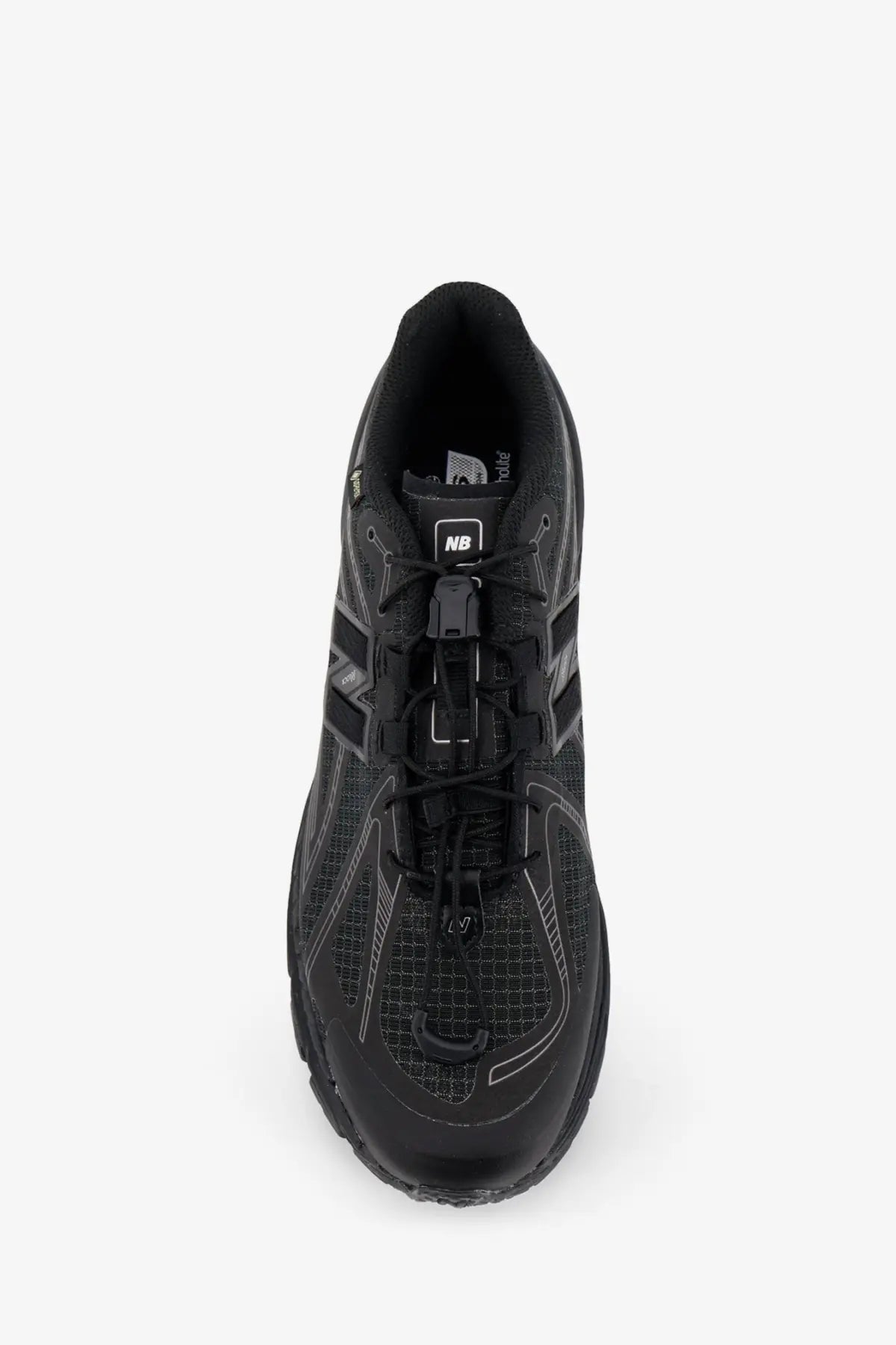 Black new balance running shoe with mesh upper and rubber outsole.