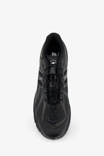 Black new balance running shoe with mesh upper and rubber outsole.