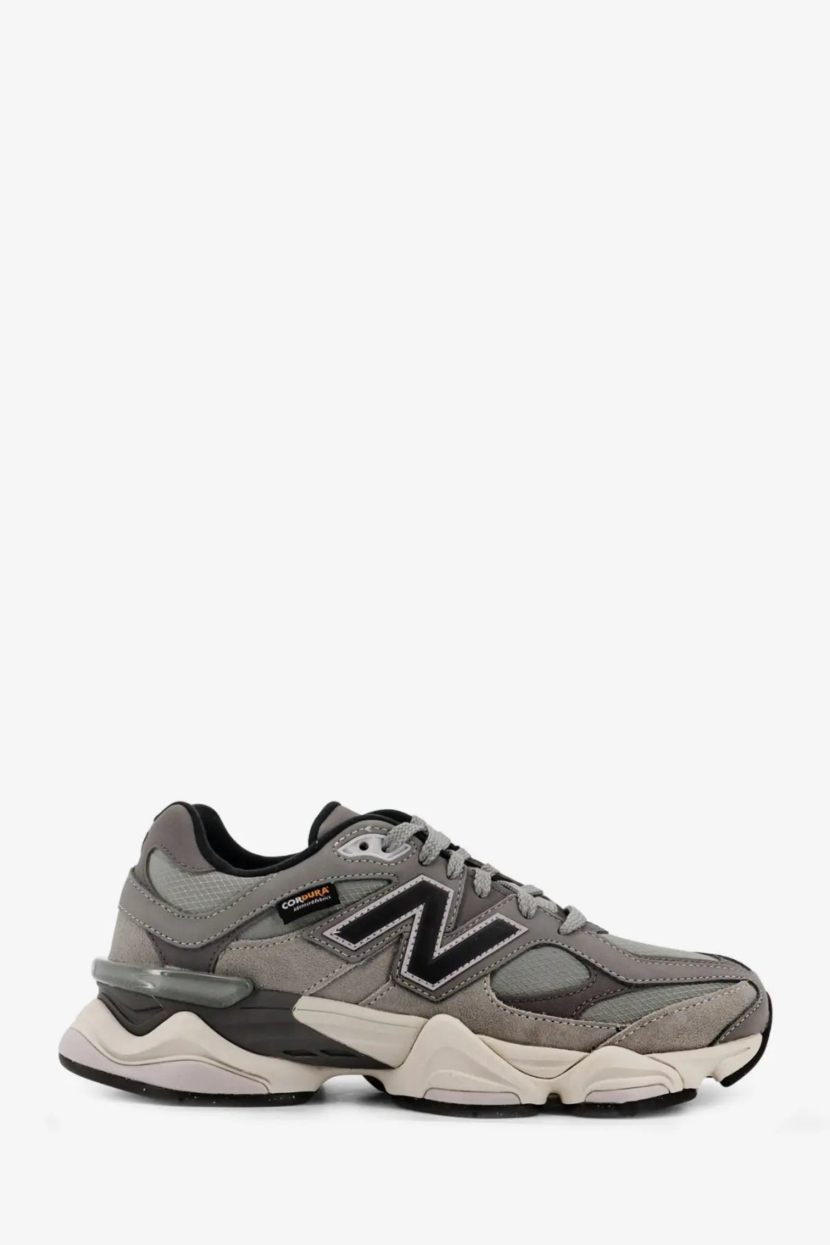 New balance men’s low top grey mesh sneakers with gray and black color and chunky layered sole design