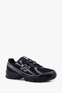 New Balance men’s mesh sneakers black with silver accents and breathable mesh upper for running and casual wear