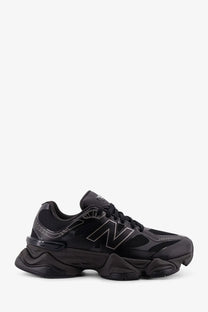 New Balance men’s mesh sneakers black with chunky textured sole and subtle gray logo detailing
