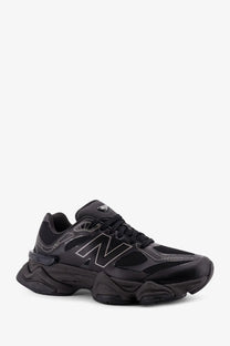 New Balance men’s mesh sneakers black featuring chunky textured sole and subtle silver logo detailing