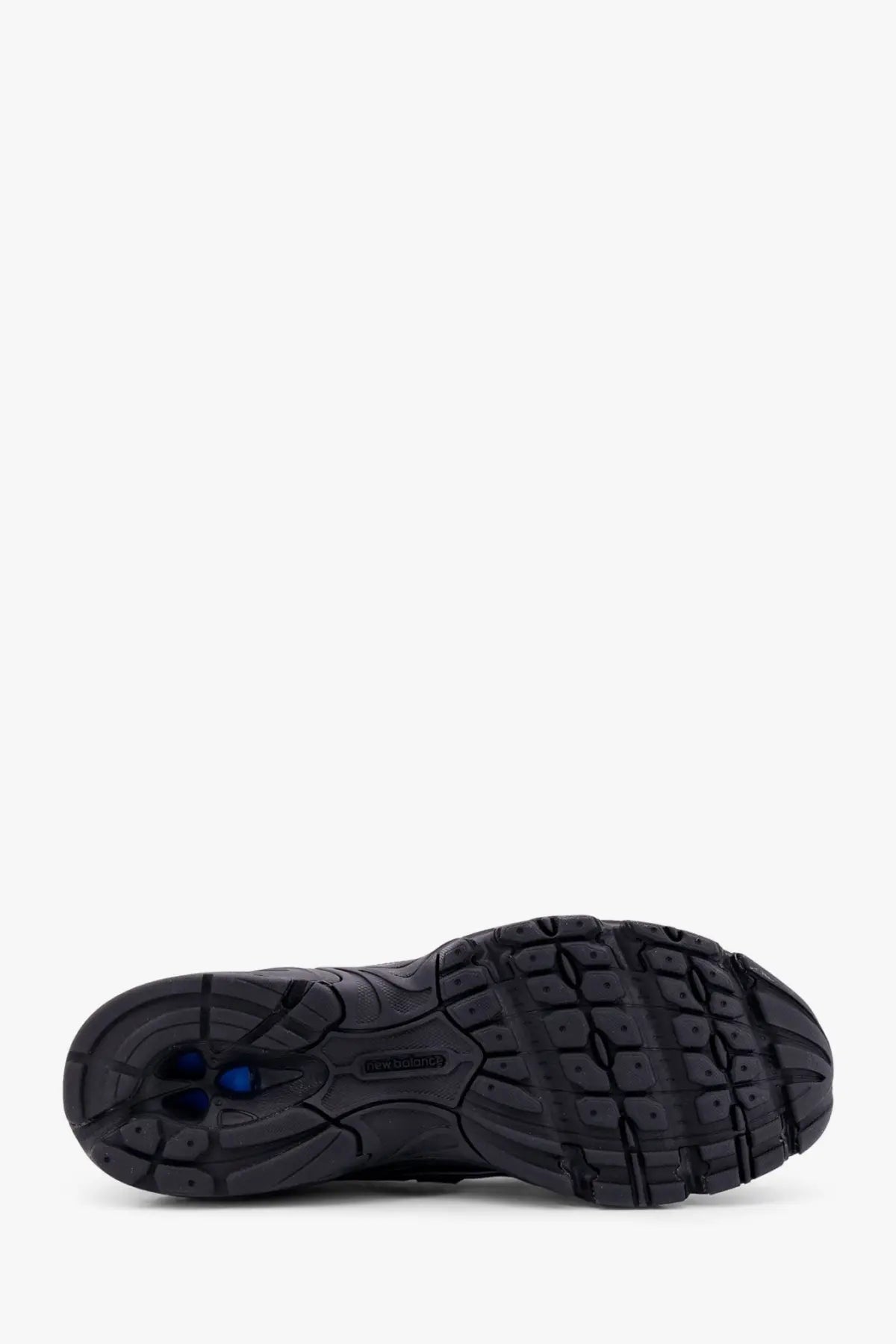 New balance men’s mesh sneakers black showing black rubber sole with textured tread and blue heel accents