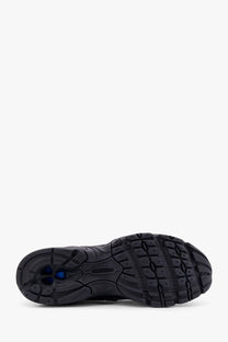 New balance men’s mesh sneakers black showing black rubber sole with textured tread and blue heel accents
