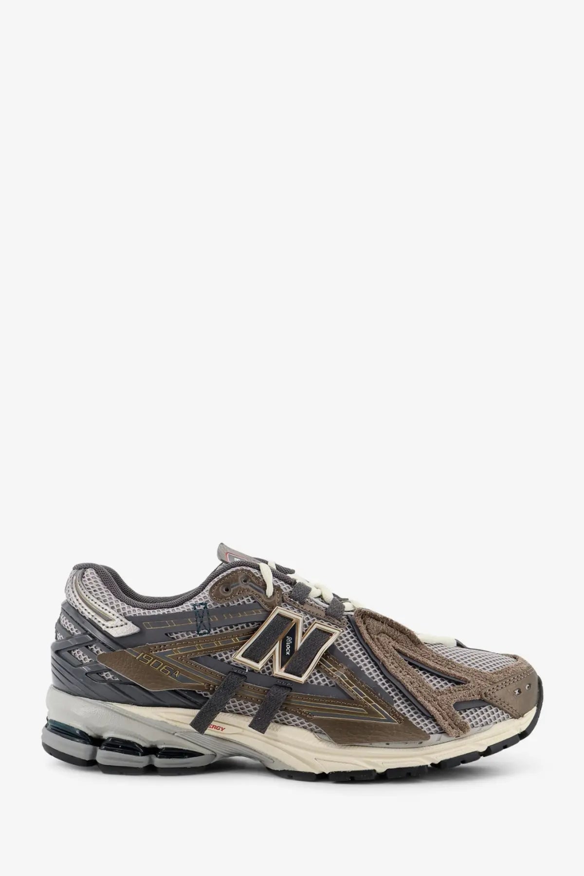 New balance men’s mesh sneakers in brown featuring muted gray brown and beige mesh and suede materials