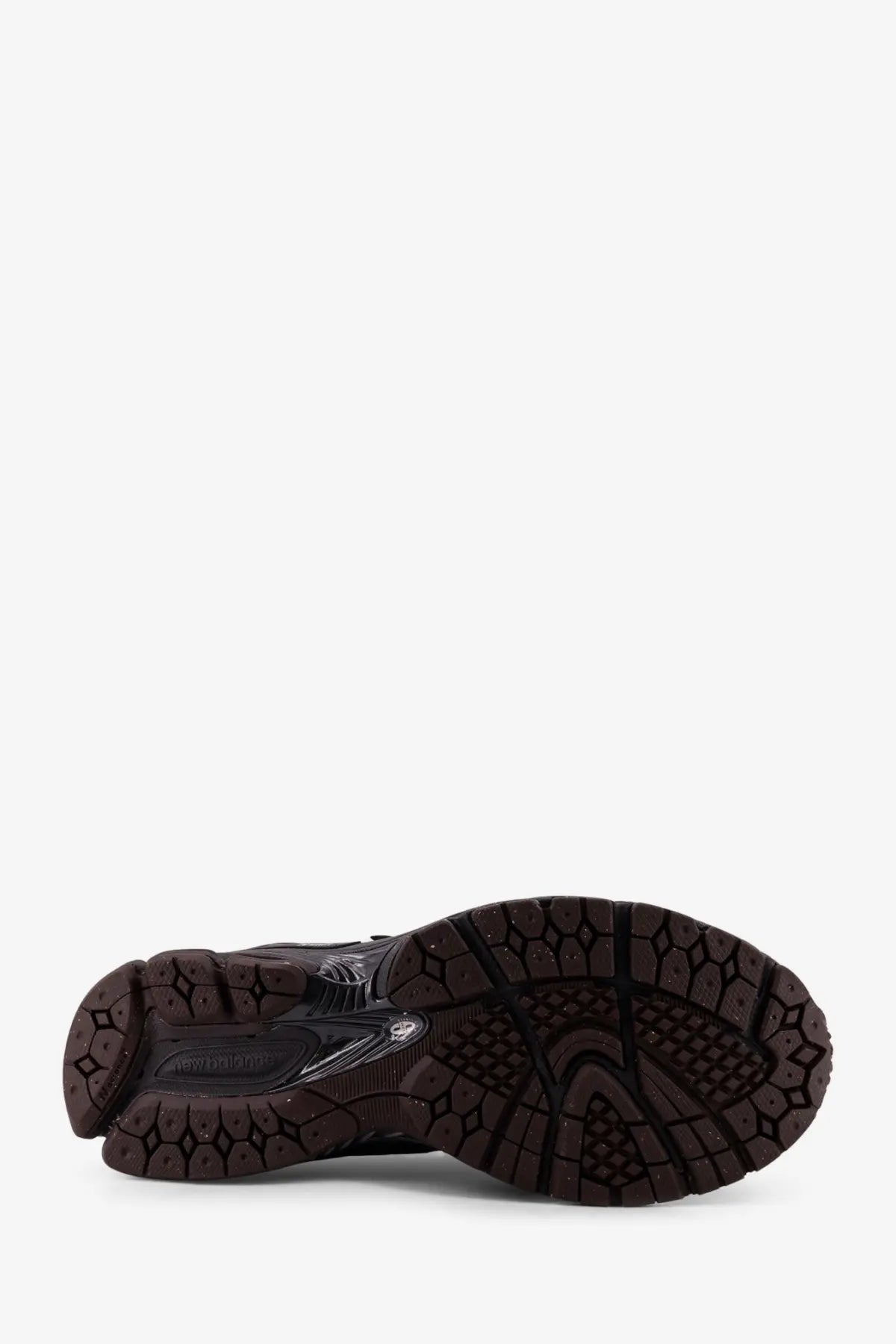 Black rubber sole with textured geometric tread and translucent accents on new balance men’s mesh sneakers grey
