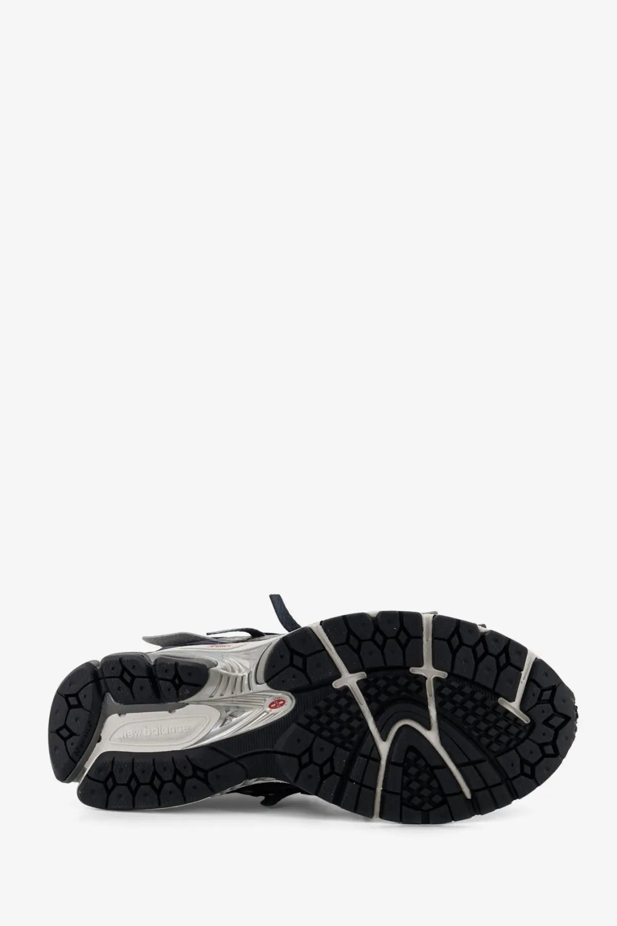 New balance men’s mesh sneakers in black and silver with textured rubber outsole for running and casual wear