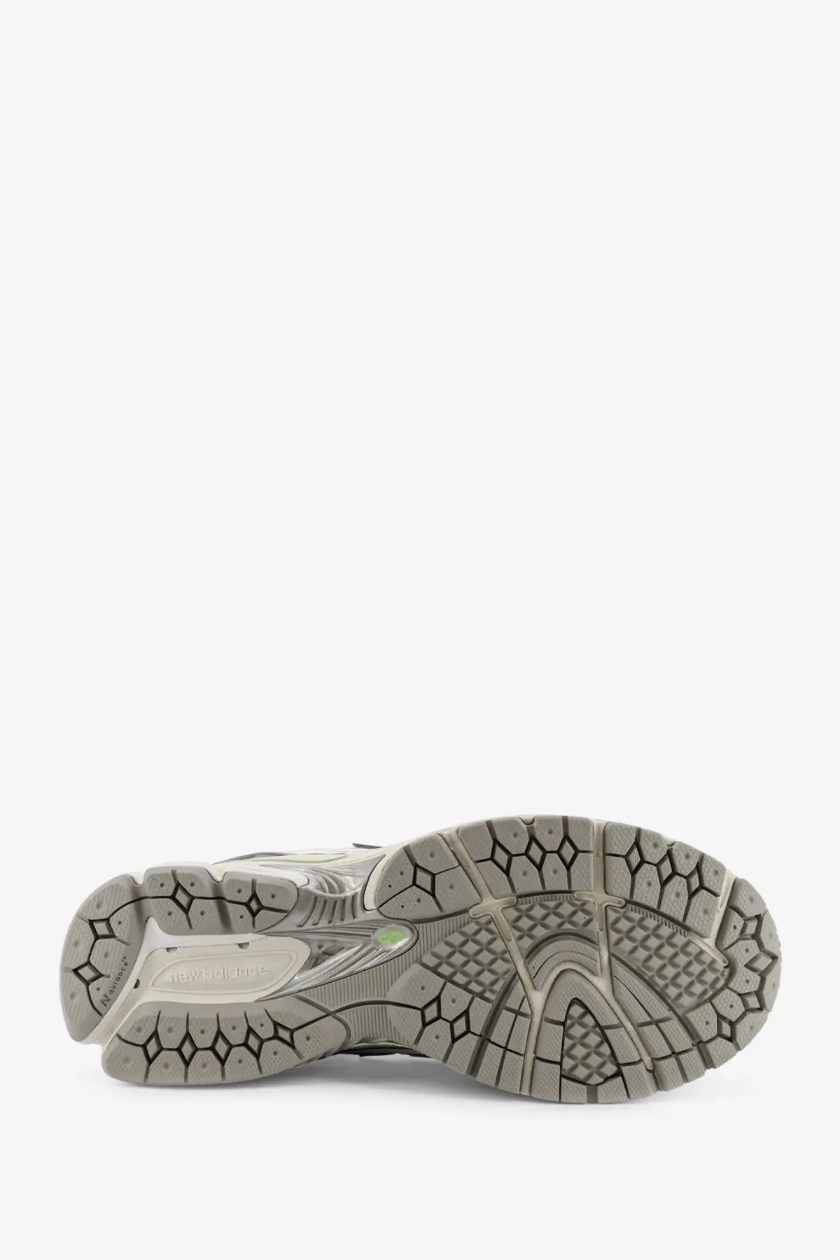 New balance men’s mesh sneakers grey with gray rubber sole honeycomb tread and white midsole logo visible