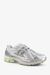 New Balance men’s mesh sneakers grey with silver and white mesh upper, gray accents, and lime green midsole