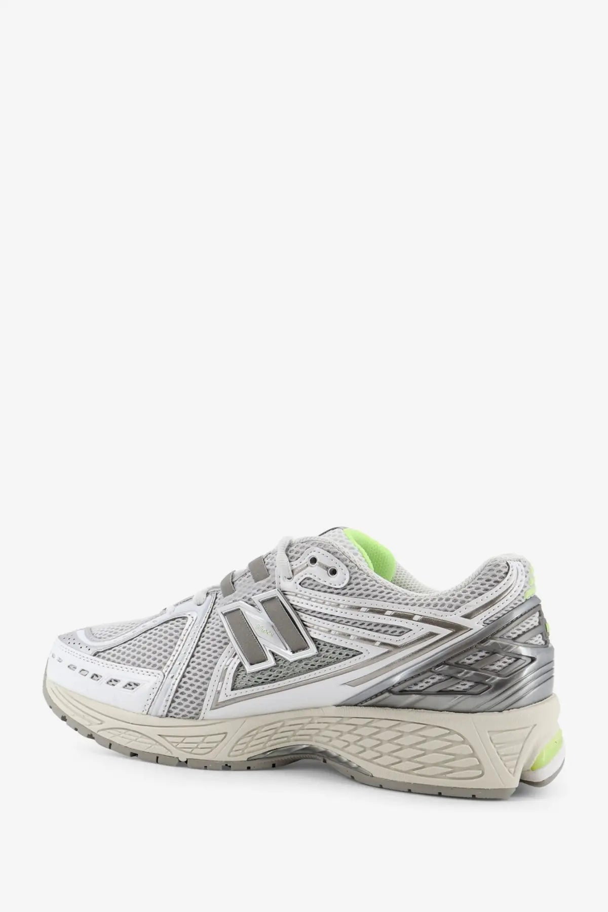 New balance men’s mesh sneakers in silver and white with neon green accents designed for running and casual wear