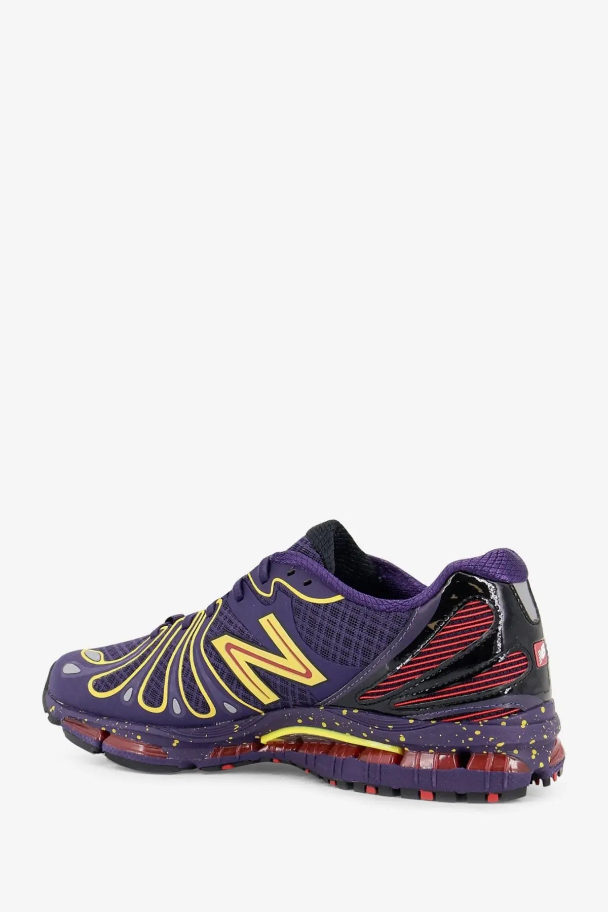 New balance men’s mesh sneakers red featuring purple mesh upper with yellow and red accents and translucent air cushioning