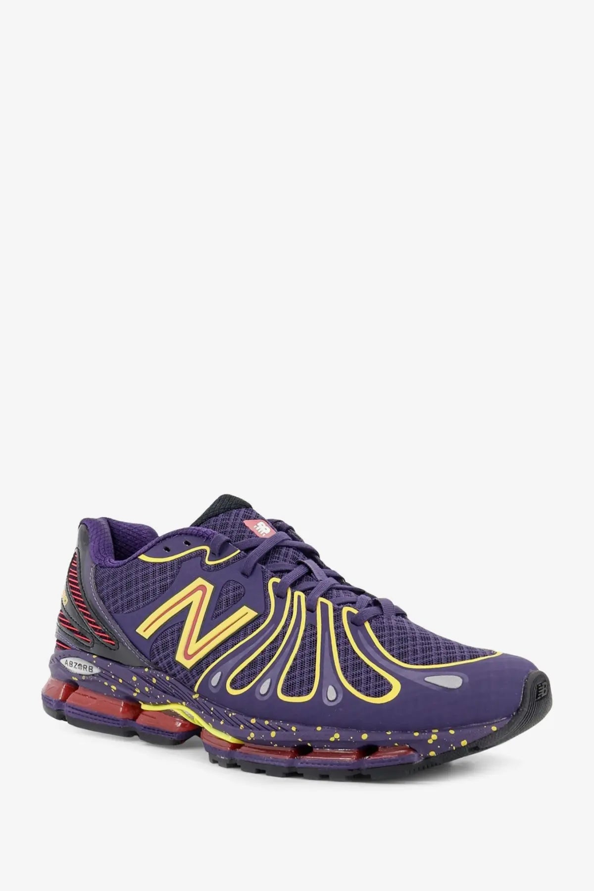 New balance men’s mesh sneakers in purple with yellow accents and red air cushion for running performance