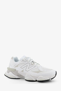 New Balance men’s mesh sneakers in white with chunky layered sole and subtle gray accents for casual wear