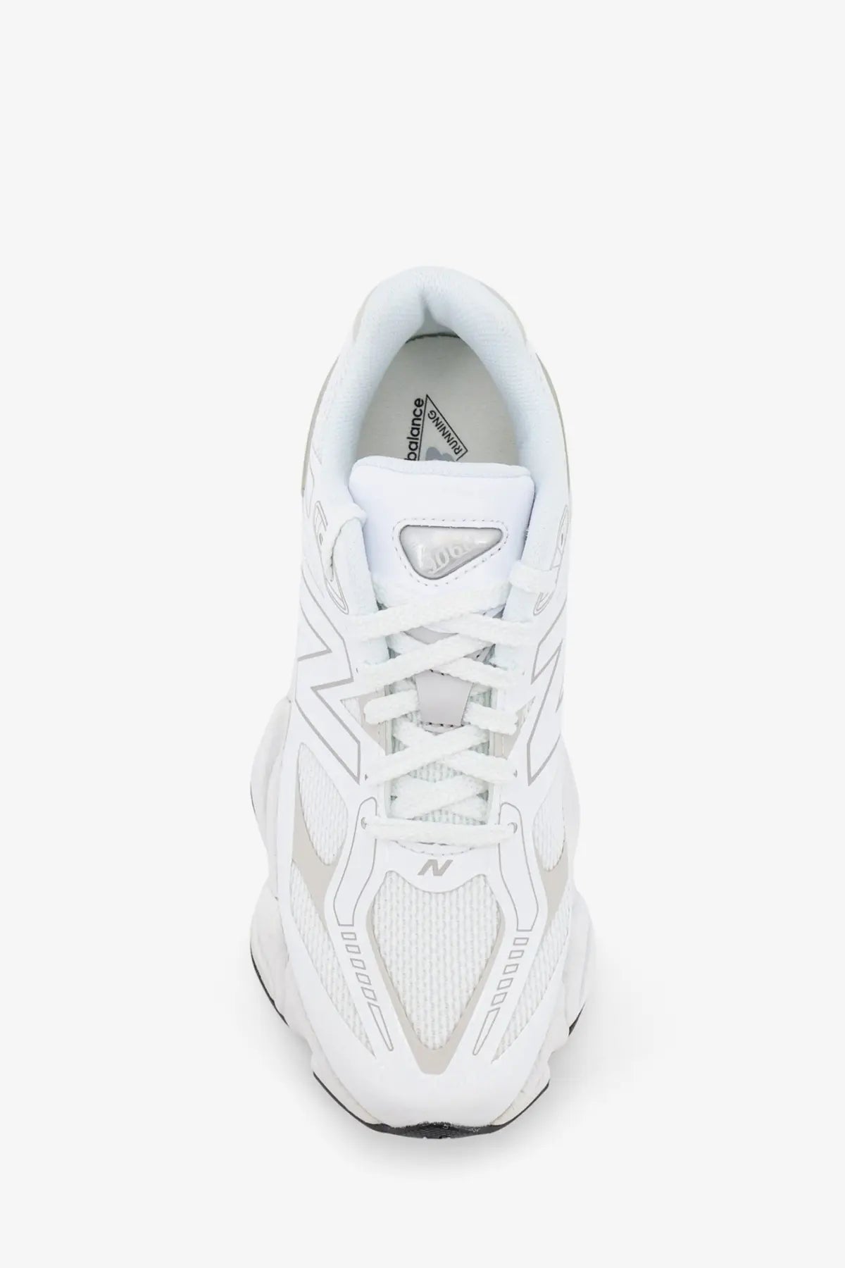 New balance men’s mesh sneakers white featuring a sleek white athletic shoe with gray accents on mesh upper