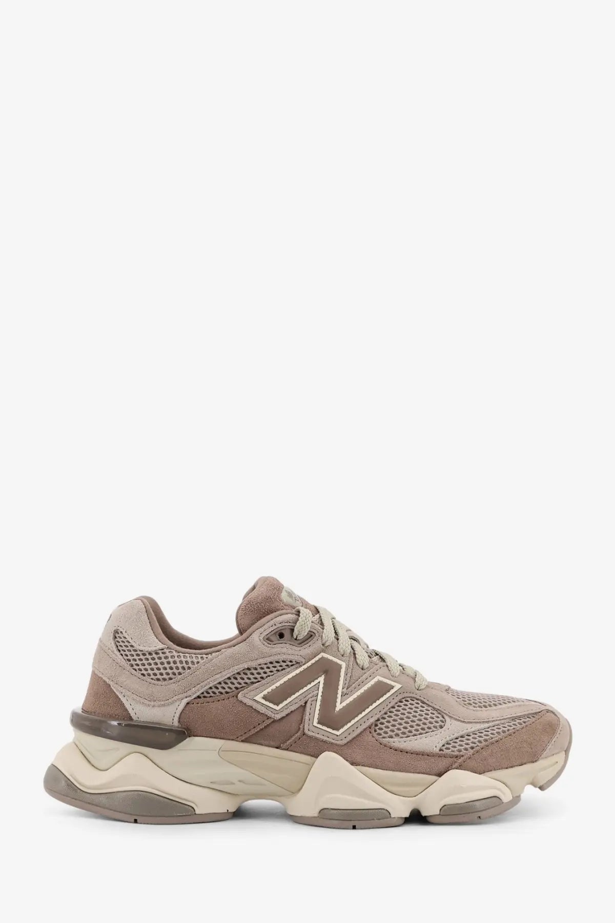 Beige new balance men’s low top 990v5 sneaker with suede and mesh upper and chunky layered rubber sole