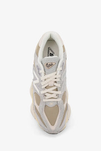 New Balance men’s mesh and suede sneakers in light gray and beige with chunky white midsole and mesh panels