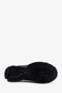 Black rubber sole with textured geometric tread on new balance men’s mesh and technical fabric loafers black