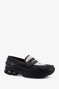 Black and white asics gel kayano 270 sneaker with mesh detailing and cushioned sole for comfortable wear