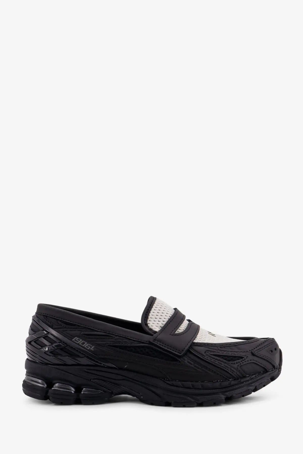 New balance men’s black mesh and technical fabric loafers with a layered design and rubber sole from asics x bape collaboration