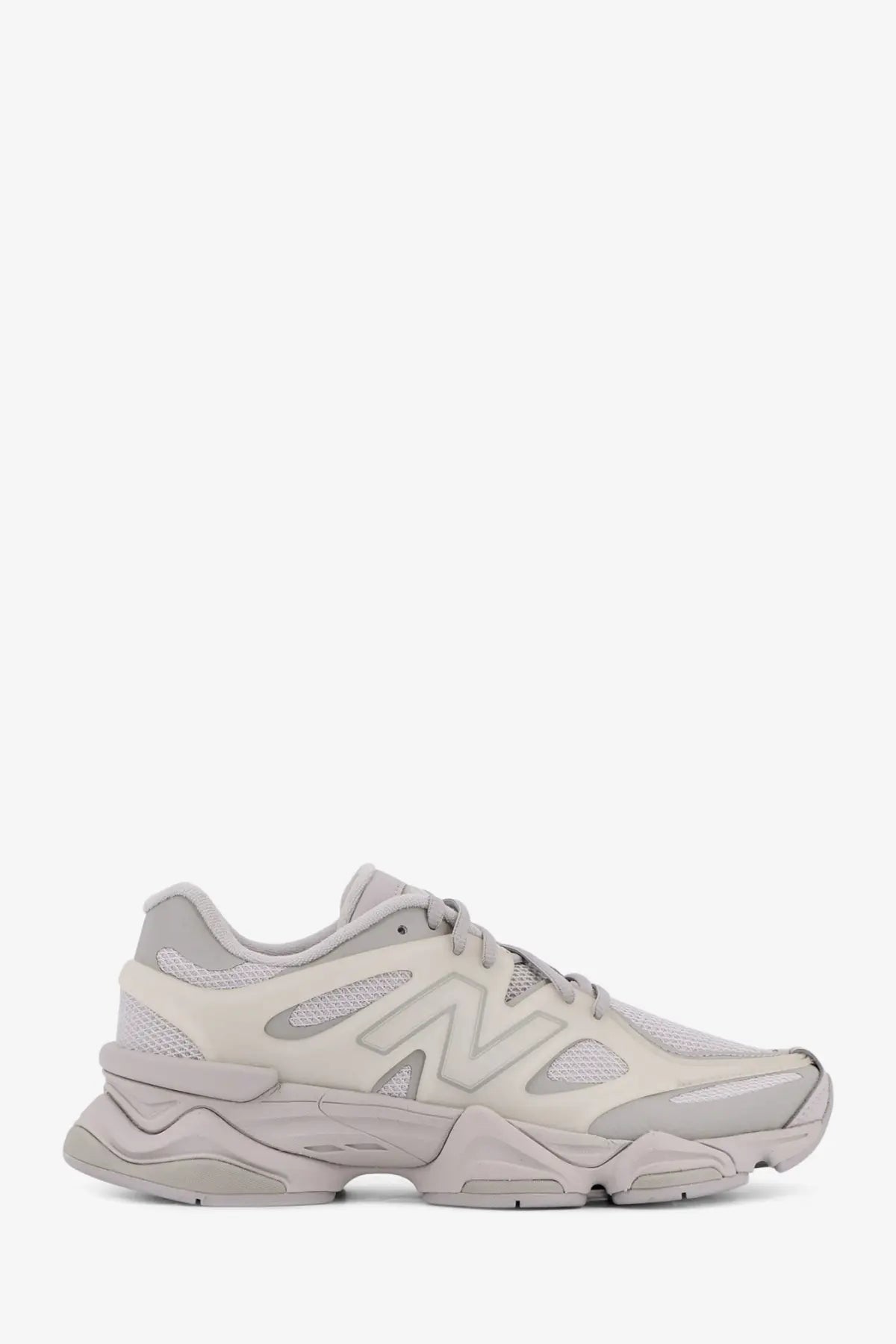 New balance men’s grey nylon sneakers with beige chunky layered sole and breathable mesh upper