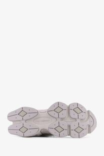 New balance men’s nylon sneakers grey with gray rubber sole featuring a chunky segmented design and diamond tread patterns