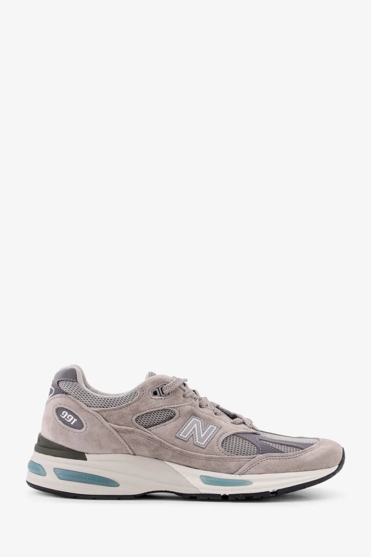 New Balance men’s grey suede and mesh running sneakers with teal accents on the midsole