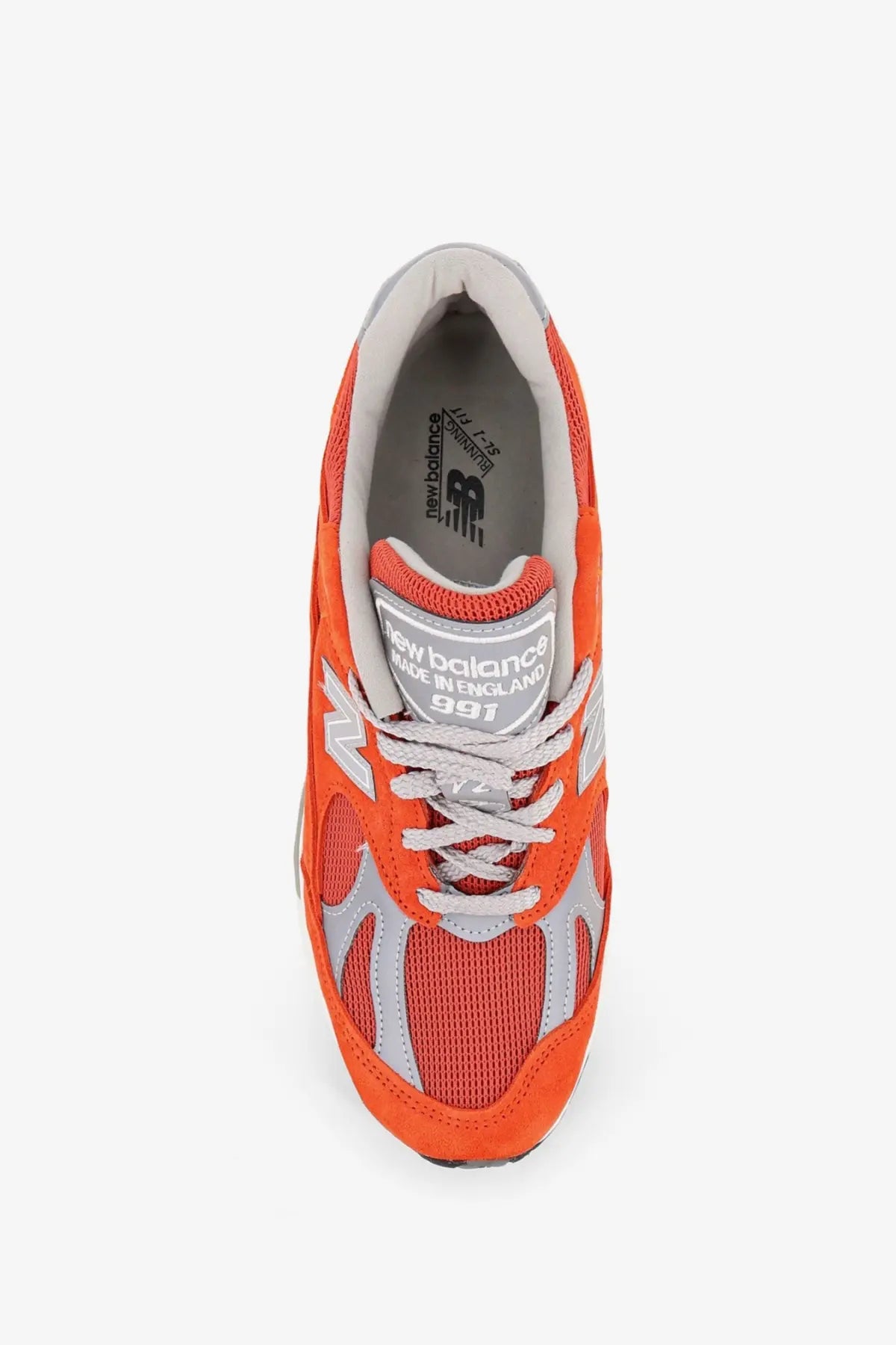 New Balance men’s suede sneakers pink featuring vibrant orange color with gray mesh and suede accents in retro design