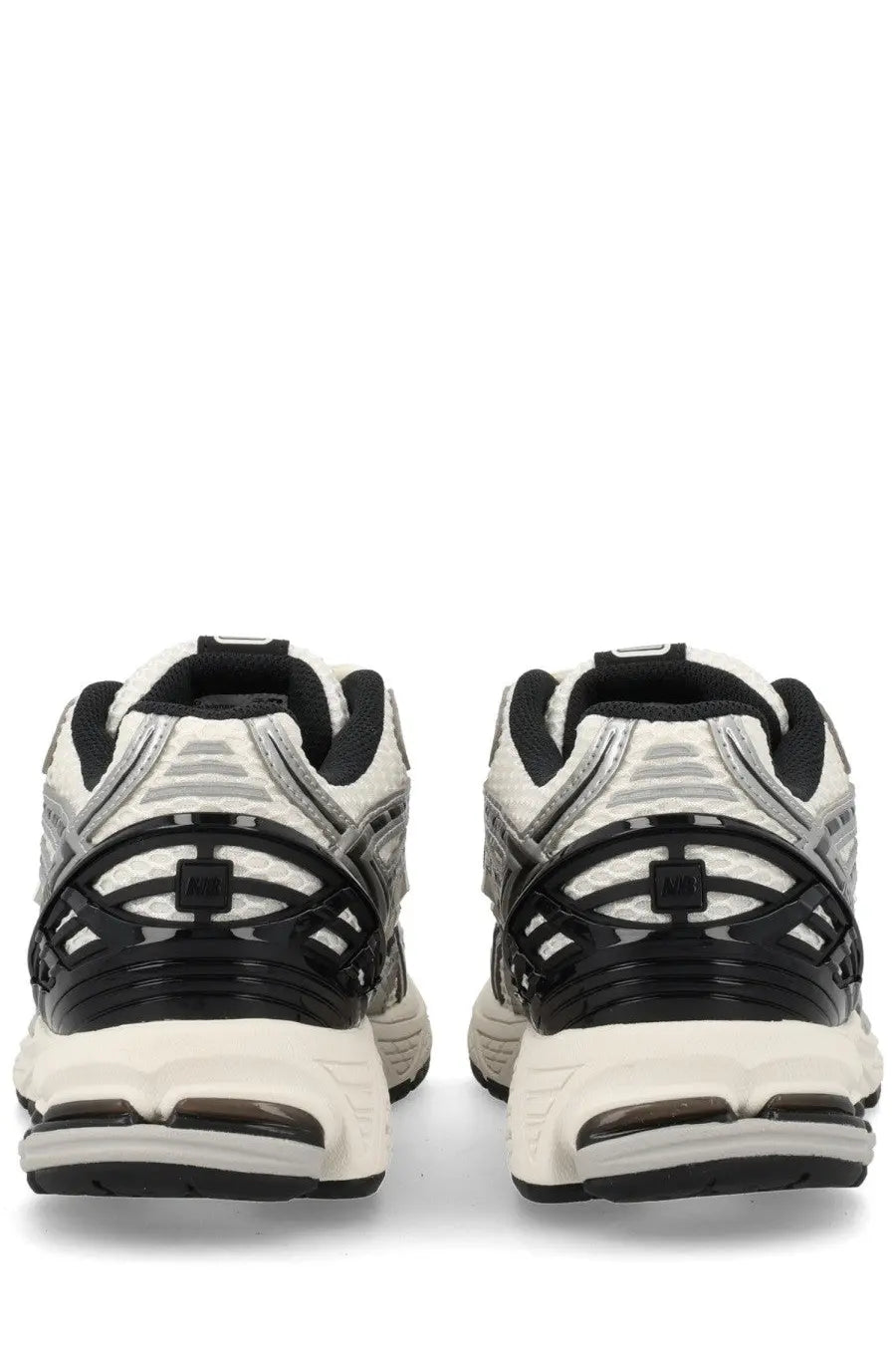 New Balance unisex sneaker 1906r silver black and white athletic shoes with mesh panels and rubber soles